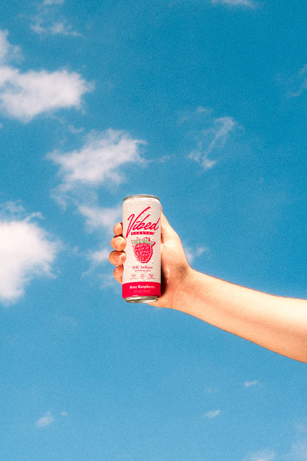Person relaxing with a Vibed seltzer